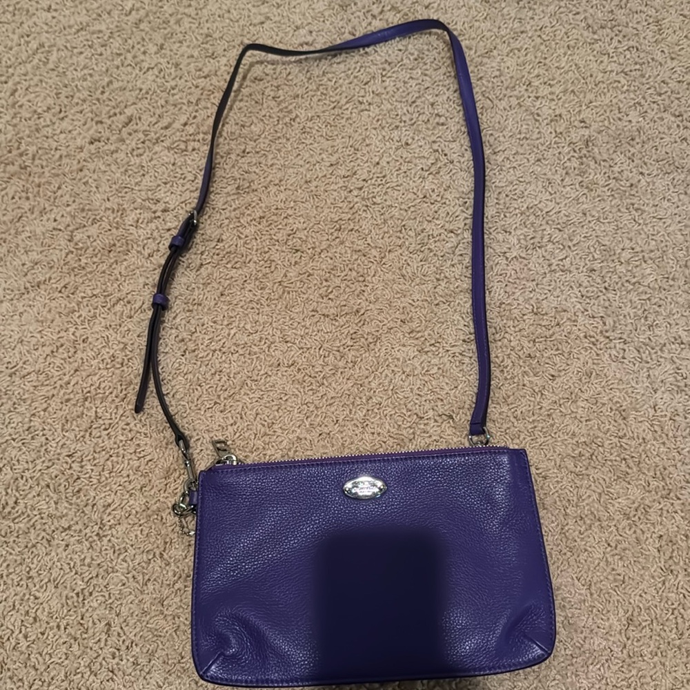 Purple Coach crossbody purse. Two zipper pockets. Great condition.